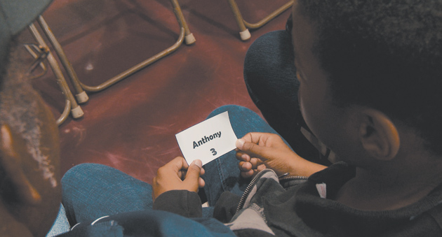 NY BOOK Review IMage of student on hte floor studying